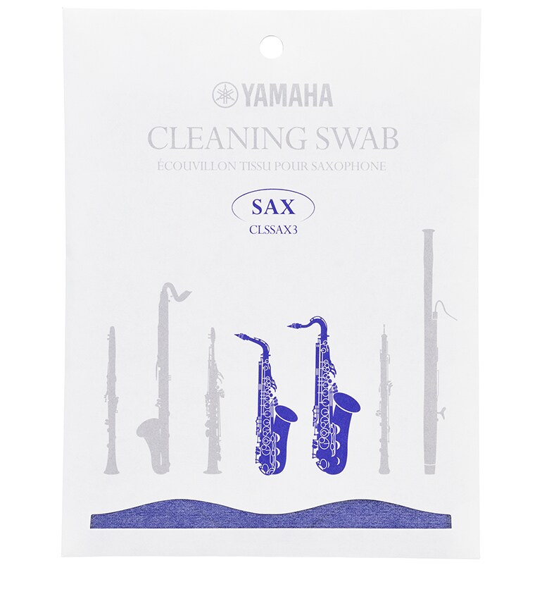 Cleaning swab for saxophone in paper packaging.