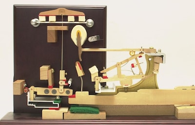 The four white parts are the damper felts. The shape of the felts varies depending on the pitch.